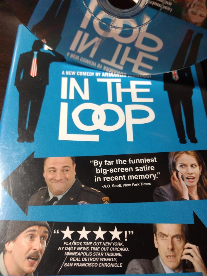 Photo of my cracked-DVD of "In the Loop", reflecting back a portion of the DVD cover.
